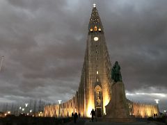 01B Hallgrimskirkja Church lit up in early evening view from the front with Leifur Eriksson statue below Reykjavik Iceland