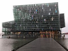 01A Harpa Concert Hall was opened in 2011 and features a distinctive colored glass facade inspired by the basalt landscape of Iceland Reykjavik Iceland