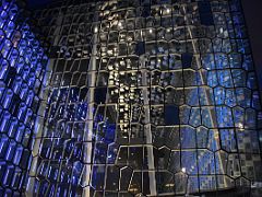 01D Harpa Concert Hall colored glass basalt facade is lit up at night detail Reykjavik Iceland