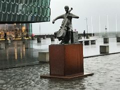 02A The Musician is a statue of Danish cellist Erling Blondal Bengtsson by sculptor Olof Palsdottir 1970 outside the Harpa Concert Hall Reykjavik Iceland