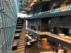 03A The distinctive glass basalt facade and ceiling, stairs, and three floors of the interior of Harpa Concert Hall Reykjavik Iceland
