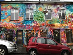 07 The entire Bread and Co bakery building is covered with a brightly painted mural by Youze Street Art Reykjavik Iceland