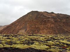 07D Driving by reddish Arnarfell mountain with green moss covered lava from road 42 Reykjanes Peninsula Iceland