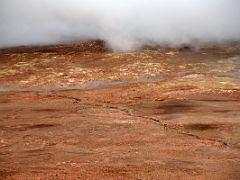 10E A huge hot steam fumarole blows over the colourful red ground at Gunnuhver geothermal area Reykjanes Peninsula Iceland