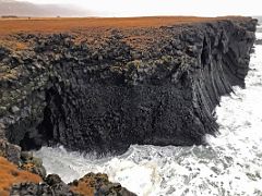 03A The sea hits the cliffs of basalt columns in Arnarstapi Snaefellsnes Peninsula Iceland