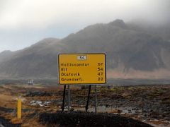01A We left Stykkisholmur and drove on Road 54 past a road distance sign towards Grundarfjordur Iceland