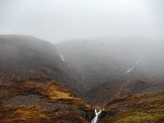 04B Waterfalls tumble off the rock cliffs of Ellidatindar next to Road 56 on Snaefellsnes Peninsula drive to Stykkisholmur Iceland
