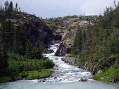 04A Passing A Small River On The White Pass and Yukon Route Train Just After Leaving Fraser BC On The Way Down To Skagway Alaska