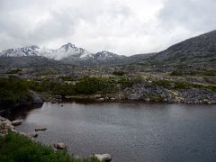 04B Passing A Small Lake With Mountains Beyond From The White Pass and Yukon Route Train Just After Leaving Fraser BC On The Way Down To Skagway Alaska