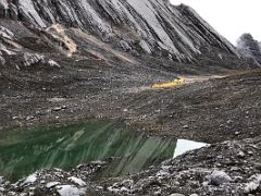 01B The Tents Of Carstensz Pyramid Base Camp Are Set Up Near A Small Lake At The Head Of The Yellow Valley