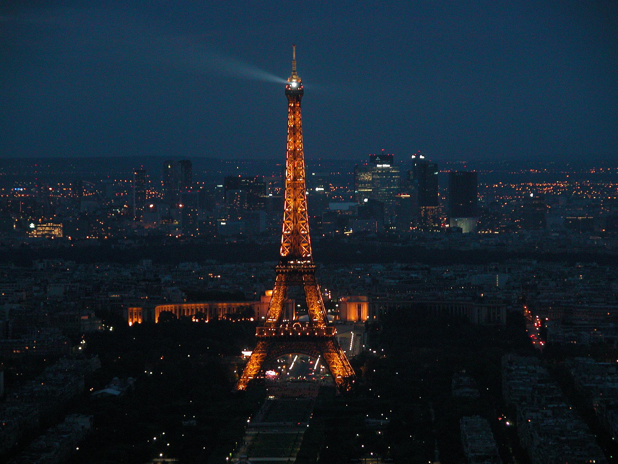 Paris 09 Evening Lights On Eiffel Tower With La Defense Behind From ...