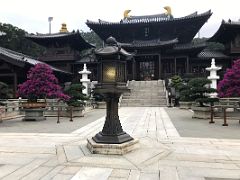 05 Hall of the Heavenly Kings is a double-eaved hall with two golden roof horns flanked by drum and bell towers from Lotus Pond Garden Chi Lin Nunnery Hong Kong