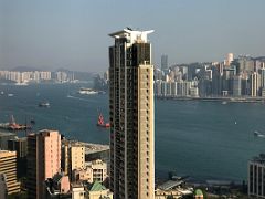 04A The 40-story Pinnacle residential skyscraper with Victoria Harbour and Yau Tong and Quarry Bay and North Point beyond from the EyeBar Kowloon Hong Kong