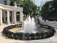 08B A tree-lined promenade leads into a fountain promenade incorporating a fountain pavilion where you can sit in Hong Kong Park