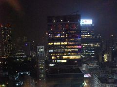 08B iSquare skyscraper from The Felix restaurant and bar at night in The Peninsula Hotel Hong Kong