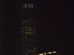 08C The time of 19 59 in lights at the top of International Commerce Centre ICC skyscraper from The Felix restaurant and bar in The Peninsula Hotel Hong Kong