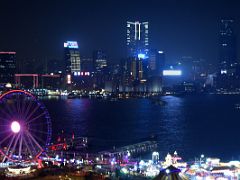 01B Honk Kong Observation ferris Wheel, Harbour City, The Masterpiece and Victoria Dockside Kowloon skyscrapers at night from Sevva rooftop bar Hong Kong