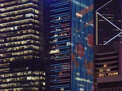 12C CCB Tower colourfully lit up at night from near Star Ferry Central pier Hong Kong