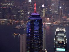 10B The Centre Building is lit up at night in orange and blue, with the IFC Mall and Victoria Harbour and Kowloon beyond from Lugard Road Victoria Peak Hong Kong