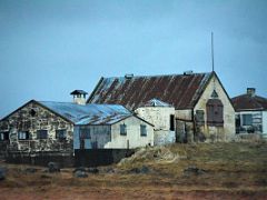 05A Driving past the buildings of a small farm on the drive from Reykjavik to Snaefellsnes Iceland