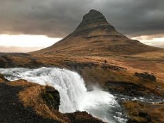 05B Looking across the Kirkjufellfoss upper waterfall to Kirkjufell Church Mountain near Grundarfjordur Snaefellsnes Peninsula Iceland