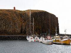 07A Boats in the harbour with the basalt island Sugandisey beyond with a lighthouse on top Stykkisholmur harbour Snaefellsnes Peninsula Iceland