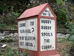 02D Looking For Survival - Do Not Belive In Fast Arrival - Safety Sign On The Road To Darjeeling Near Sikkim India