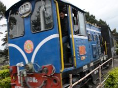 02D The Caboose Leads The Darjeeling Himalayan Railway Toy Train Departing From Batasia Loop In Darjeeling Near Sikkim India