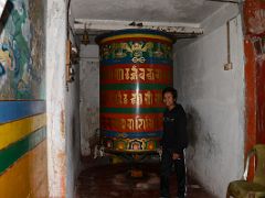 02B Tenzing Turns A Large Prayer Wheel At Yiga Choeling Gompa Monastery In Ghoom Near Darjeeling Near Sikkim India