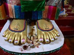 03D Offerings At The Feet Of The Maitreya Buddha Statue Inside Yiga Choeling Gompa Monastery In Ghoom Near Darjeeling Near Sikkim India