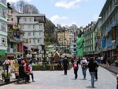 04A People Relax On Benches While Others Shop And Others Take Photos Of The Mahatma Gandhi Bust Statue In MG Marg Shopping Area Of Gangtok Sikkim India