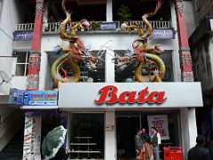 05A Sculptures of Colourful Oriental Dragons Adorn the Bata Shoe Store Building at MG Marg Shopping Area Of Gangtok Sikkim India