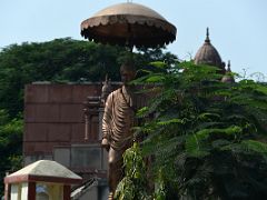 04A Statue Under Umbrella At Roundabout In Varanasi India