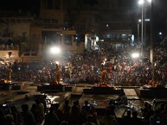 07C Four Brahmins Hold A Lamp High With Flames Shooting Into the Air Before The People Seated On The Ghat Steps In The Ganga Aarti Fire Ceremony On The Banks Of The Ganges Varanasi India