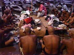 01B Pilgrims Eat Food Before Sunrise At Dashashwamedh Ghat On The Banks Of The Ganges River Varanasi India