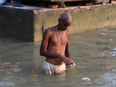 14 A Pilgrim In The Ganges River Next To The Manikarnika Burning Ghat After Sunrise From Tourist Boat On Ganges River Varanasi India