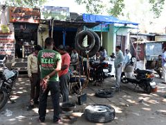 01E Car And Motorcycle Repair Shop On The Street Of Varanasi Old Town India