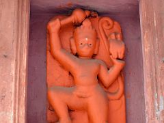 12C Orange Carved Hindu Figure At A Small Temple In Varanasi Old Town India