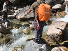 07A My Guide Sunil Crosses A Side Stream On The Way To Rest Camp On Day 4 Of Kangchenjunga East Face Green Lake Trek Sikkim India