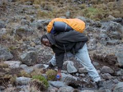 03A My Guide Filling His Water Bottle On The Trek Between Shira And Baranco Camps On Day 3 Of The Machame Route Climb Mount Kilimanjaro Kili October 2000