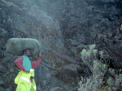 01A Porter Pauses Before Rock Climbing Between Baranco And Barafu Camps On Day 4 Of Machame Route Mount Kilimanjaro Kili Climb October 2000