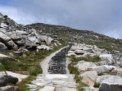 02A The Kosciuszko Summit Walking Track Continues To Contour With The Mount Kosciuszko Summit Above On The Mount Kosciuszko Australia Hike