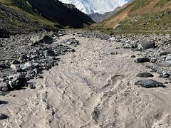 04B Looking back at Lenin Peak with the river flowing beneath the bridge on our hike to Tulpar Lake from Ak-Sai Travel Lenin Peak Base Camp 3600m