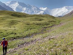 03B Hiking on the low shoulder of Pik Petrovski with Lenin Peak beyond on day hike from Ak-Sai Travel Lenin Peak Base Camp 3600m