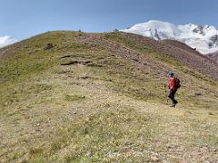 07C Hiking on the shoulder ridge of Pik Petrovski with Pik Petrovski beyond on day hike from Ak-Sai Travel Lenin Peak Base Camp 3600m