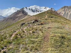 08A Hiking on the shoulder ridge at 4000m of Pik Petrovski with Lenin Peak and Pik Petrovski beyond on day hike from Ak-Sai Travel Lenin Peak Base Camp 3600m