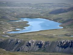 09C The large lake and surrounding countryside from shoulder ridge 4000m of Pik Petrovski on day hike from Ak-Sai Travel Lenin Peak Base Camp 3600m