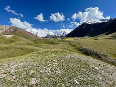 04A The green fields of Ak-Sai Travel Lenin Peak Base Camp 3600m lead to Lenin Peak and Pik Petrovski on the right