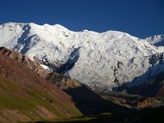 08A Peak of the 19th Party Congress of the CPSU and Unity Peak shine white at sunset from Ak-Sai Travel Lenin Peak Base Camp 3600m