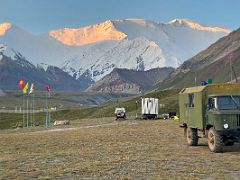 09B The first rays of sunrise burn Pik Spartak and Lenin Peak orange from Ak-Sai Travel Lenin Peak Base Camp 3600m